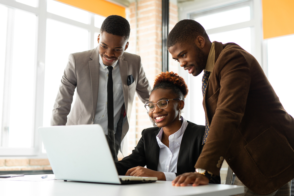 Team,Of,Young,African,People,In,Office,At,Table,With