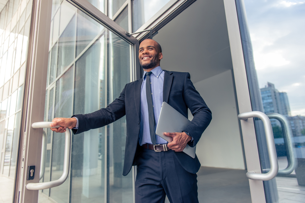Low,Angle,View,Of,Handsome,Young,Afro,American,Businessman,In